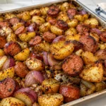 SHEET PAN SAUSAGE AND POTATOES RECIPE FOR AN EASY DINNER 🍽️ Sheet pan sausage and potatoes recipe is the perfect easy weeknight dinner! Enjoy juicy smoked sausage, crispy roasted potatoes, garlic, and flavorful herbs in one simple pan. Perfect for busy families and easy cleanup!