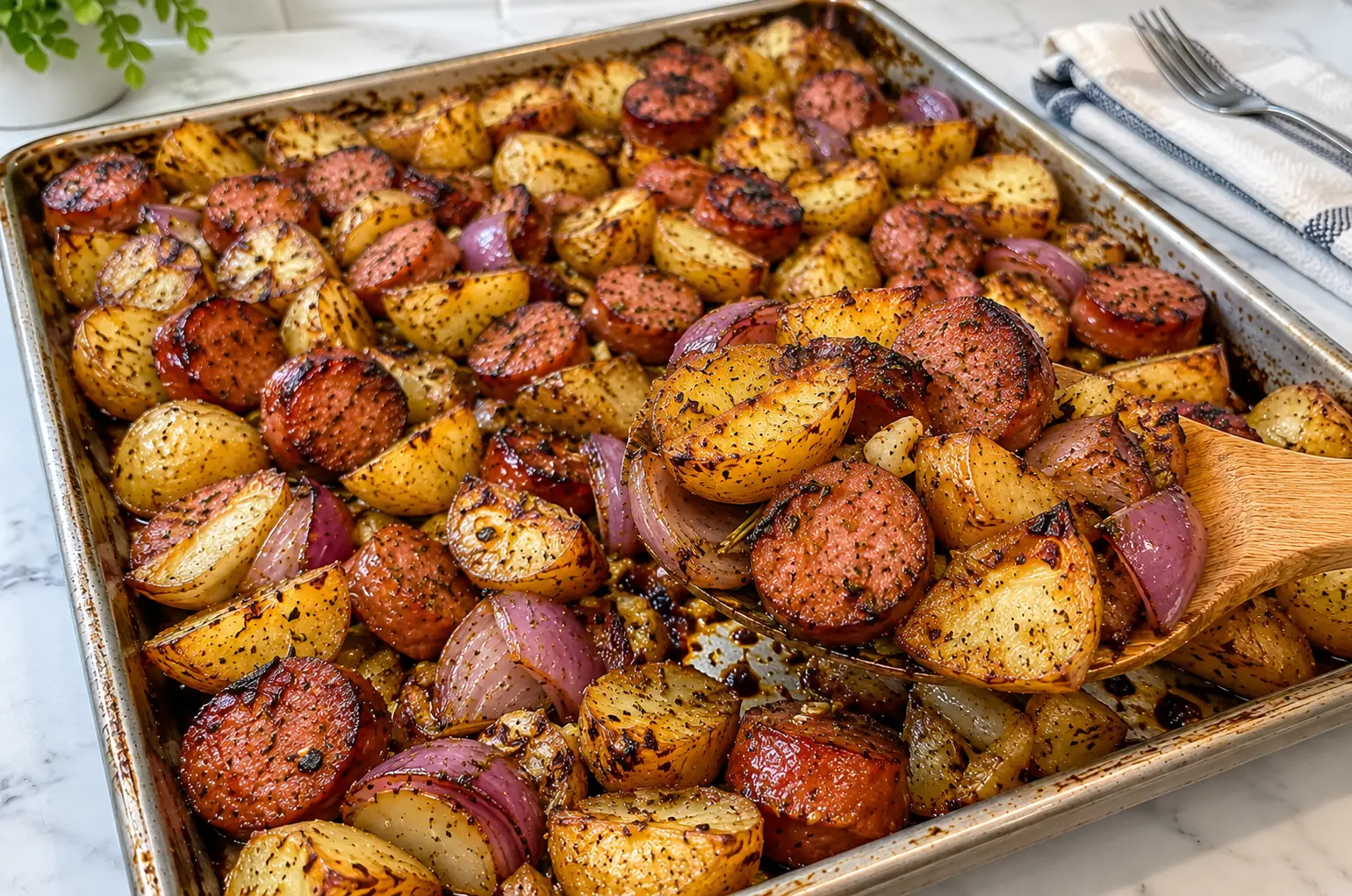 SHEET PAN SAUSAGE AND POTATOES RECIPE FOR AN EASY DINNER 🍽️ Sheet pan sausage and potatoes recipe is the perfect easy weeknight dinner! Enjoy juicy smoked sausage, crispy roasted potatoes, garlic, and flavorful herbs in one simple pan. Perfect for busy families and easy cleanup!